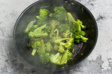 In the same pan, add the chopped **broccoli **along with a splash of **water**. Let the water evaporate, then add a bit of **oil **and roast the broccoli for **3–4 minutes.** Season with **salt **and **pepper**.
