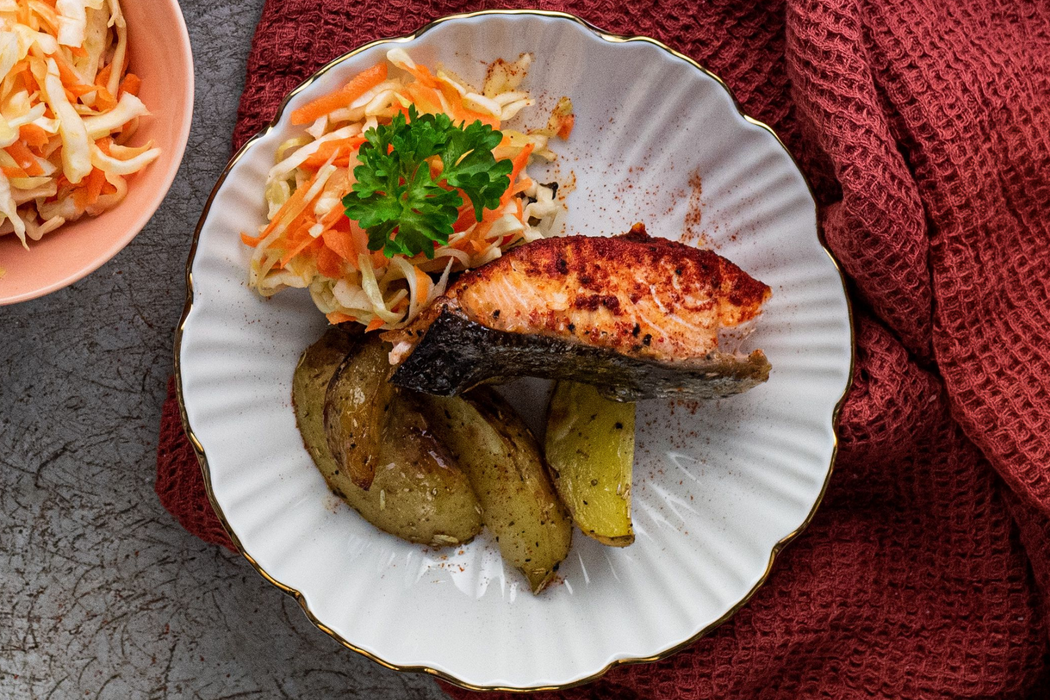 Roasted BBQ salmon with baked potatoes and cabbage-carrot salad