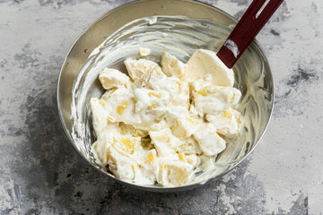 Cut the cooled **potatoes **into 1 cm cubes, and mix with **sour cream**, **lemon pepper**, and **salt**.
