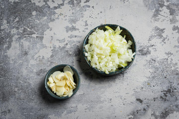 Heat the oven to **220 degrees**. If possible, use the grill mode, if it's not available, use the normal reverse air.
Clean and chop the **onion **and **garlic**.

