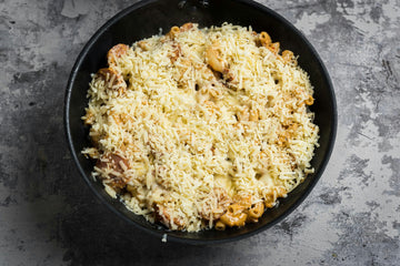 If you did not use an ovenproof pan, pour the **mixture **to the baking dish. Sprinkle **grated cheese **on top and put the mold in the oven. Bake in a** 220 degree** oven for **5-8 minutes**, depending on the mode, until the **cheese **has melted on top.
